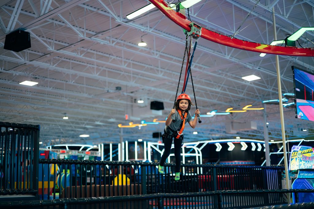 A kid on the air coaster that soars through Lululand's indoor park