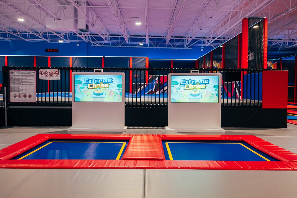 Interactive TV screen to play games while jumping on trampoline