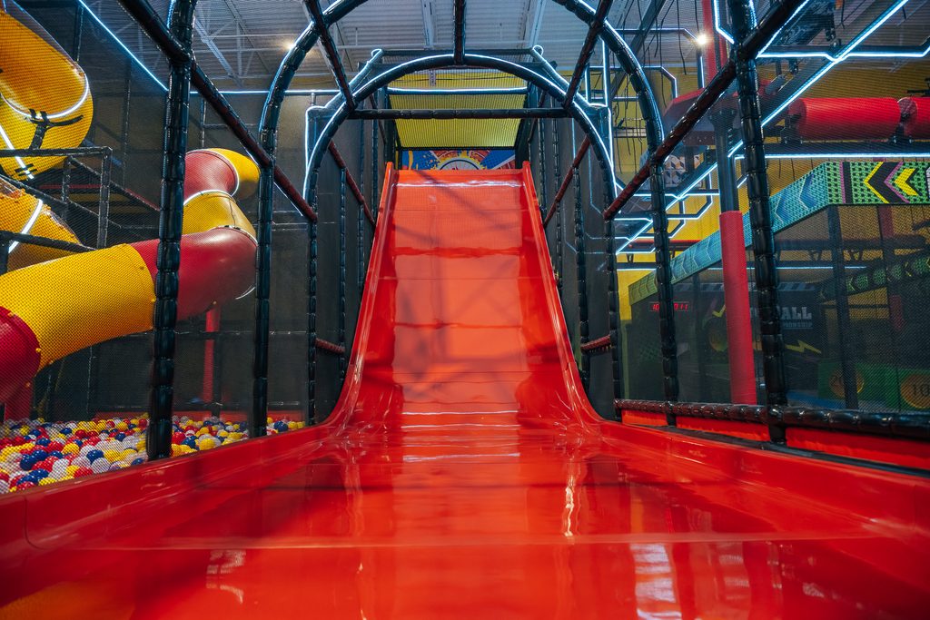 Tall slide that leads to ball pit area